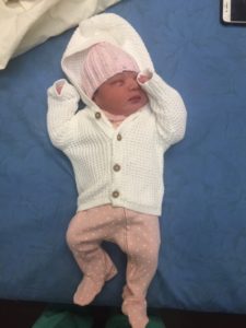 baby Olivia in a knitted clothing